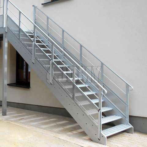 Fire escape evacuation exterior stairs Aluminium stairs made for egress and access and placed outside of a medium sized building.